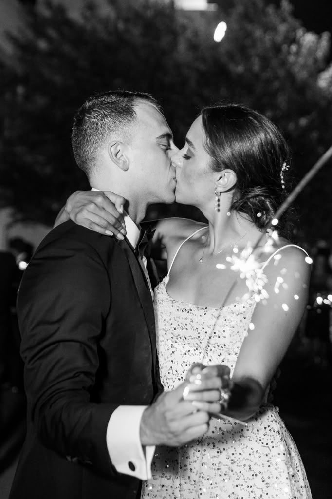 Black and white kiss illuminated by sparklers
